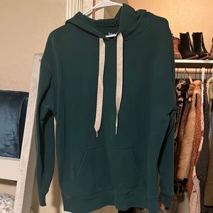 Green hoodie with gold sparkly drawstrings